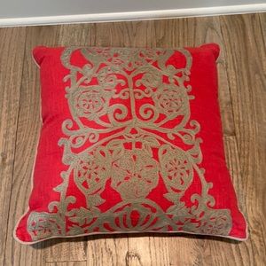 Coral and gray throw pillow.